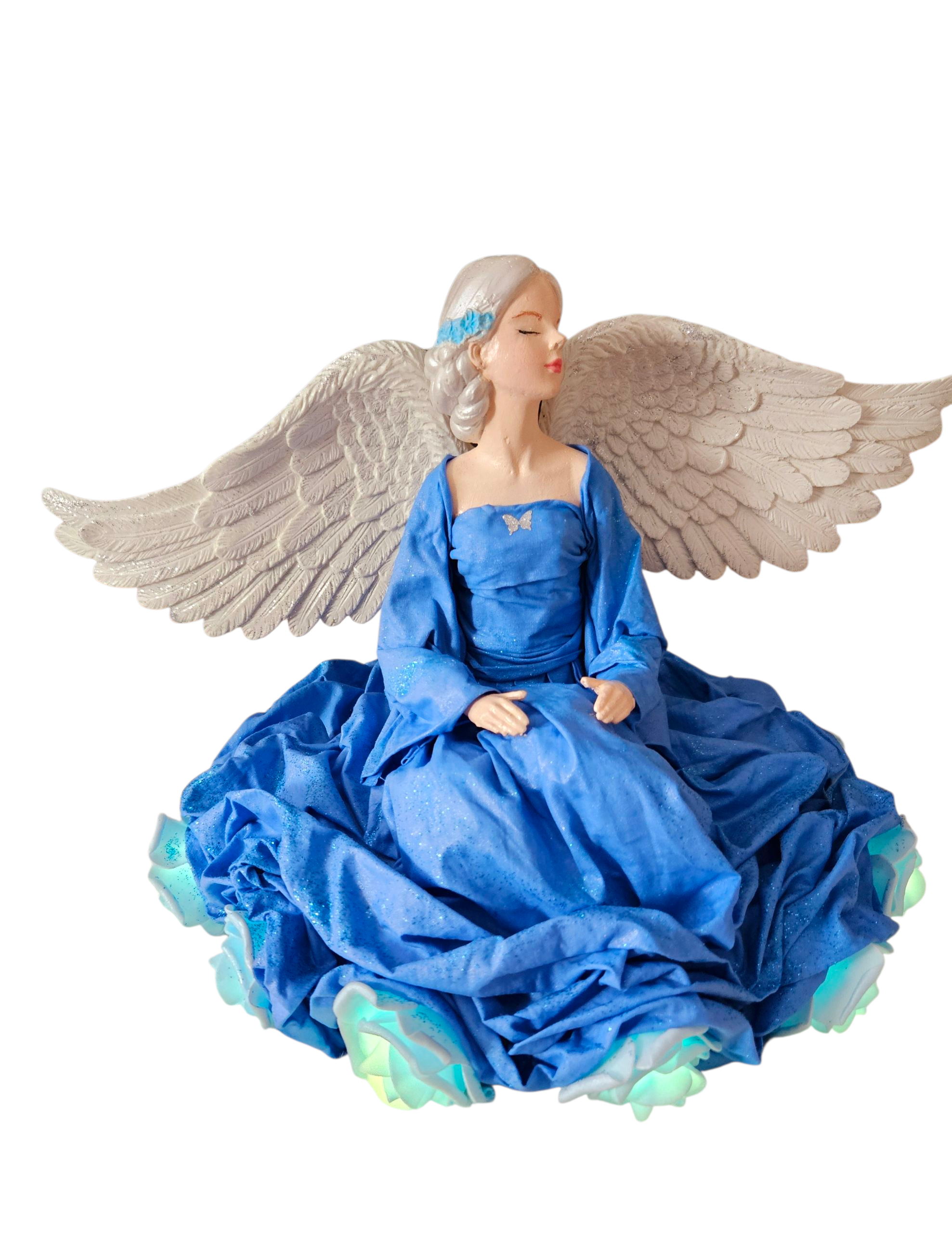 Andělka sedící s LED světlem